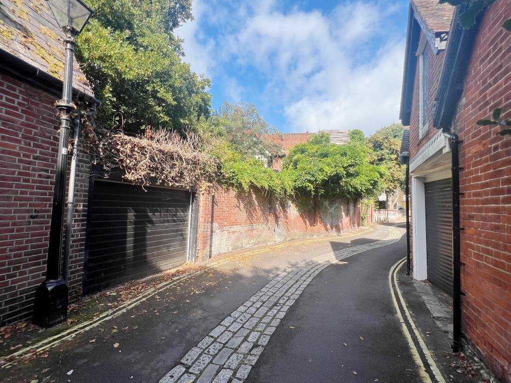 Lot: 29 - DETACHED HOUSE WITH ROOF TERRACE AND GARDEN IN CENTRAL SOUTHSEA - Outside view of walled garden and garage
